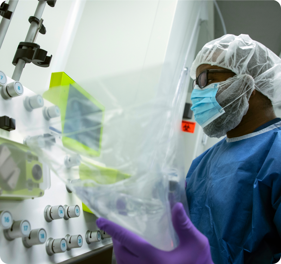 Scientist inspecting a bioprocessing bag in the lab